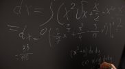 equations written on blackboard