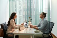 Human Resources manager talking to job candidate, discussing his skills and expected salary